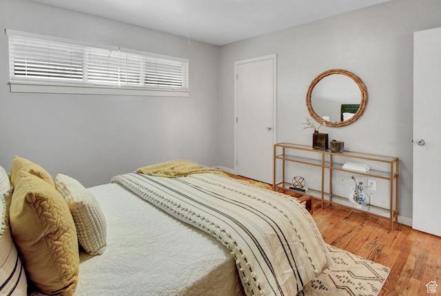 650 N 300 W Unit 202, Salt Lake City, UT 84103 - bedroom with baseboards and wood finished floors