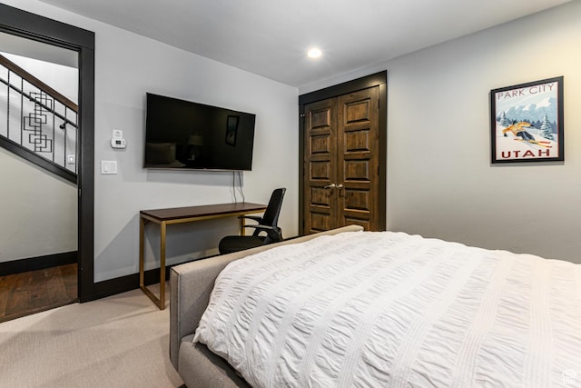 carpeted bedroom with baseboards and recessed lighting