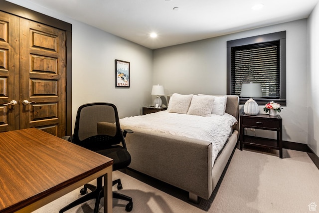 carpeted bedroom with baseboards and recessed lighting