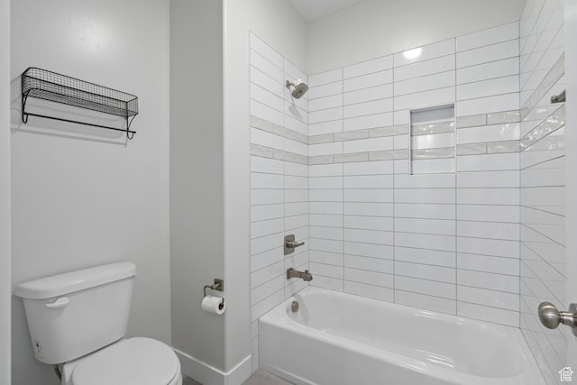 full bath featuring toilet, shower / bath combination, and baseboards
