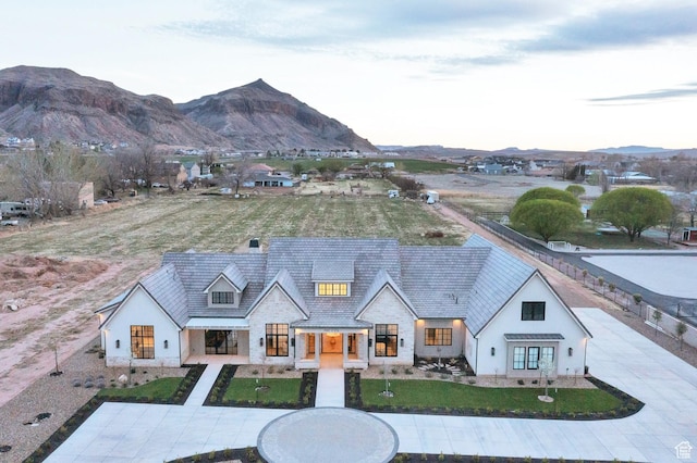 view of front of home with stucco siding and a mountain view