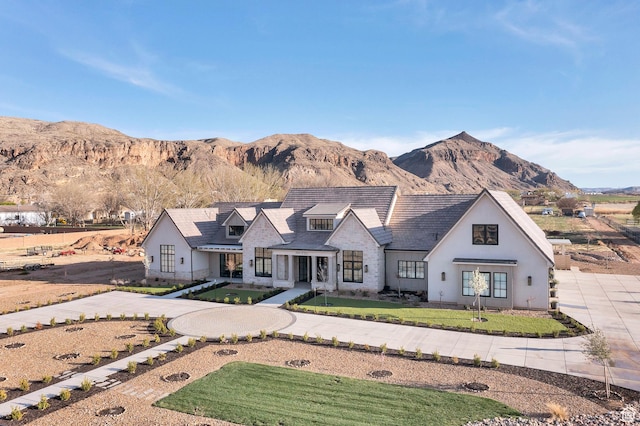 775 W 1300 S, Hurricane, UT 84737 - view of front of home with a mountain view, a front lawn, stucco siding, and stone siding