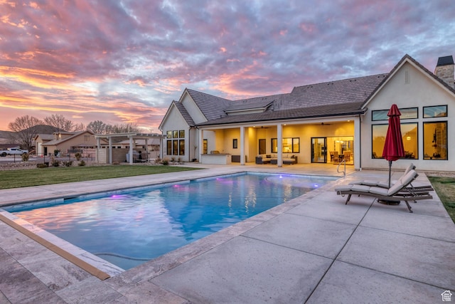 775 W 1300 S, Hurricane, UT 84737 - pool at dusk featuring a pergola, a patio, an outdoor hangout area, and an outdoor pool