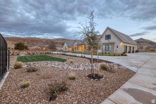 775 W 1300 S, Hurricane, UT 84737 - view of yard featuring curved driveway, a garage, and fence