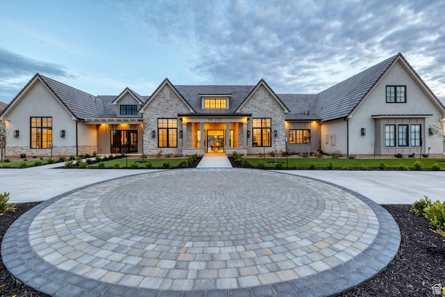 775 W 1300 S, Hurricane, UT 84737 - view of front of house featuring stone siding, stucco siding, french doors, and curved driveway