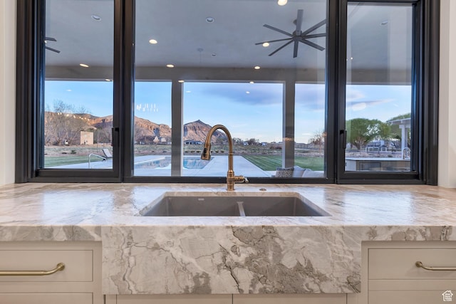 775 W 1300 S, Hurricane, UT 84737 - kitchen featuring a sink, plenty of natural light, and light stone countertops