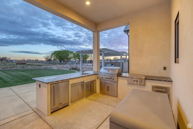 775 W 1300 S, Hurricane, UT 84737 - view of patio / terrace with grilling area, an outdoor kitchen, a sink, and fence