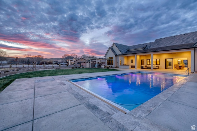 775 W 1300 S, Hurricane, UT 84737 - pool at dusk featuring a patio area, an outdoor pool, and a yard