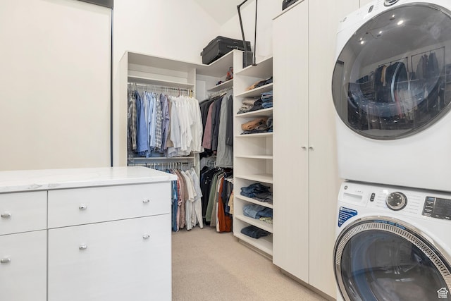 775 W 1300 S, Hurricane, UT 84737 - laundry area with stacked washer and clothes dryer, light colored carpet, and cabinet space