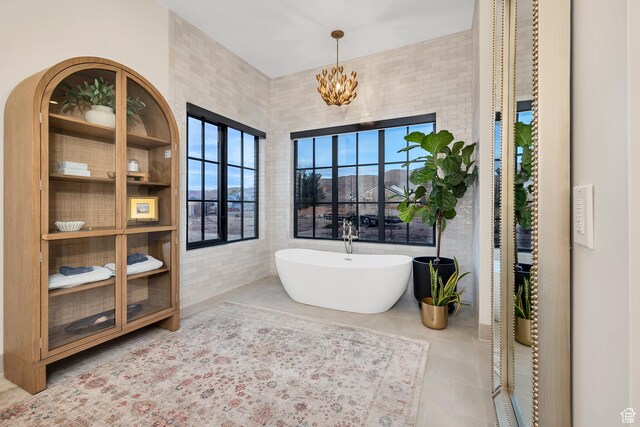 775 W 1300 S, Hurricane, UT 84737 - bathroom with a soaking tub, a chandelier, and tile patterned flooring