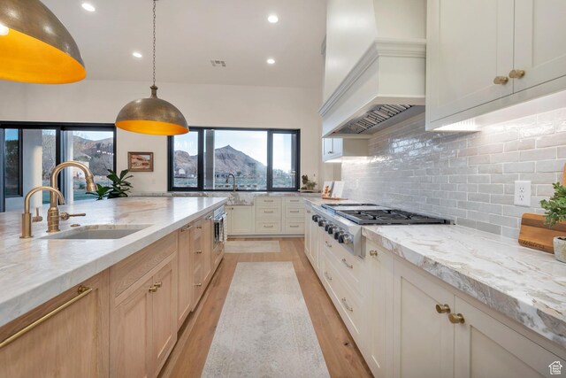 775 W 1300 S, Hurricane, UT 84737 - kitchen with a sink, custom range hood, stainless steel gas cooktop, healthy amount of natural light, and recessed lighting