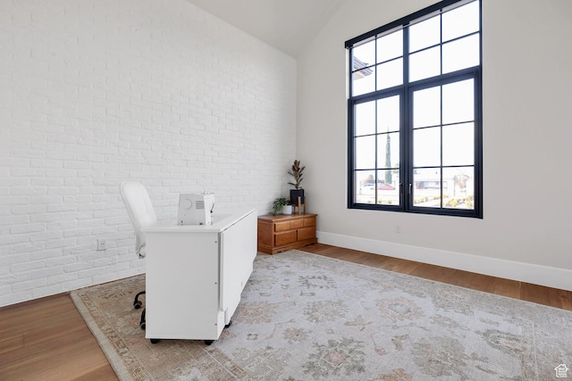 775 W 1300 S, Hurricane, UT 84737 - office featuring brick wall, wood finished floors, plenty of natural light, baseboards, and vaulted ceiling