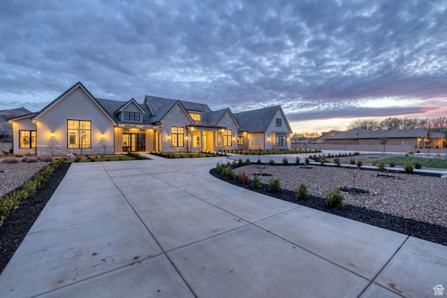775 W 1300 S, Hurricane, UT 84737 - view of front of home featuring stone siding, stucco siding, and curved driveway