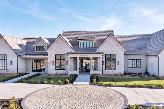 775 W 1300 S, Hurricane, UT 84737 - view of front facade featuring stone siding, a front lawn, french doors, and curved driveway