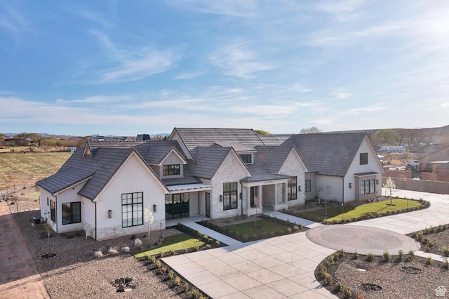 775 W 1300 S, Hurricane, UT 84737 - view of front of home with stone siding, stucco siding, and curved driveway