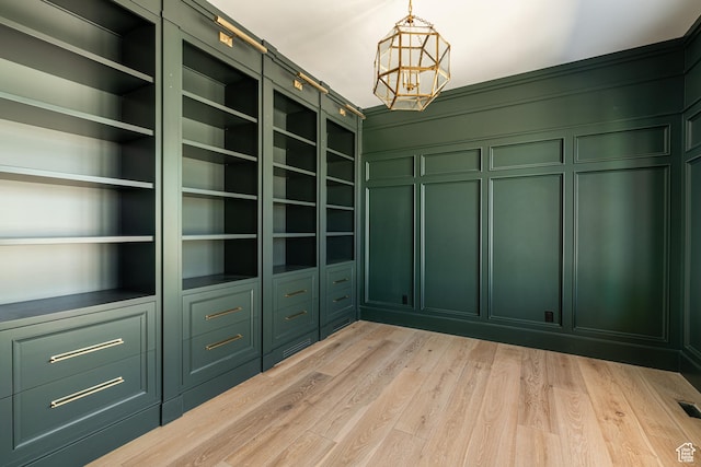 131 S Meadow Dr Unit 20, Springville, UT 84663 - walk in closet featuring light wood-type flooring and a chandelier