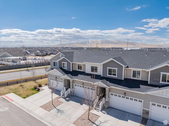 607 N Glenwilde Rd Unit 116, Vineyard, UT 84059 - view of front of house featuring an attached garage, a shingled roof, concrete driveway, and a residential view