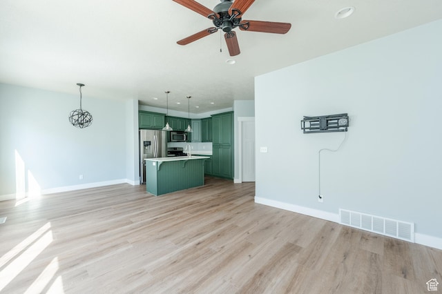 607 N Glenwilde Rd Unit 116, Vineyard, UT 84059 - unfurnished living room with recessed lighting, baseboards, ceiling fan, light wood-style flooring, and visible vents