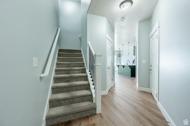 607 N Glenwilde Rd Unit 116, Vineyard, UT 84059 - staircase with baseboards and wood finished floors