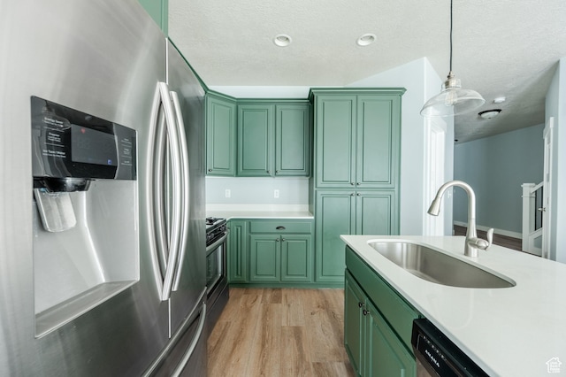 607 N Glenwilde Rd Unit 116, Vineyard, UT 84059 - kitchen with light countertops, green cabinetry, a sink, and appliances with stainless steel finishes
