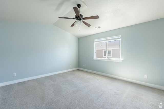 607 N Glenwilde Rd Unit 116, Vineyard, UT 84059 - spare room featuring visible vents, baseboards, ceiling fan, carpet floors, and vaulted ceiling