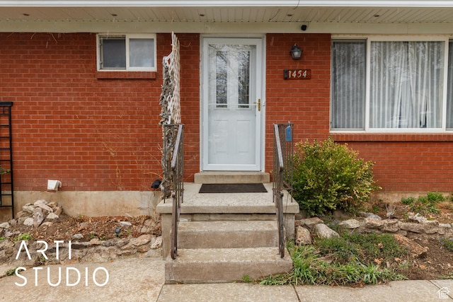 1454 E Harrop St, Ogden, UT 84404 - doorway to property with brick siding