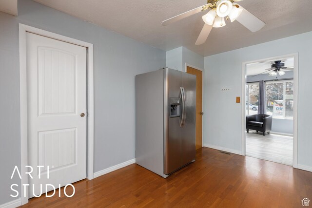 1454 E Harrop St, Ogden, UT 84404 - interior space with dark wood-type flooring, visible vents, baseboards, and stainless steel refrigerator with ice dispenser