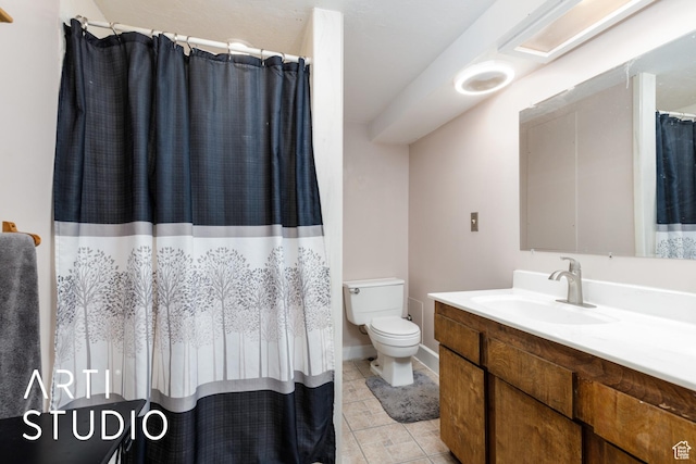 1454 E Harrop St, Ogden, UT 84404 - full bath with baseboards, a shower with shower curtain, toilet, vanity, and tile patterned floors