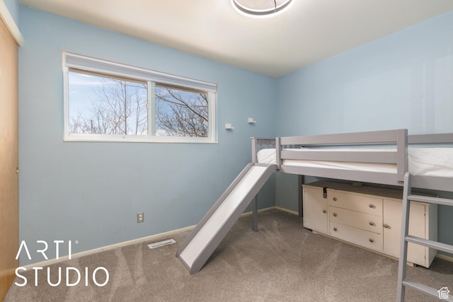 1454 E Harrop St, Ogden, UT 84404 - unfurnished bedroom with carpet flooring, visible vents, and baseboards