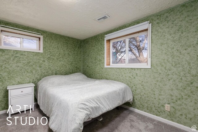 1454 E Harrop St, Ogden, UT 84404 - carpeted bedroom with visible vents, baseboards, and a textured ceiling