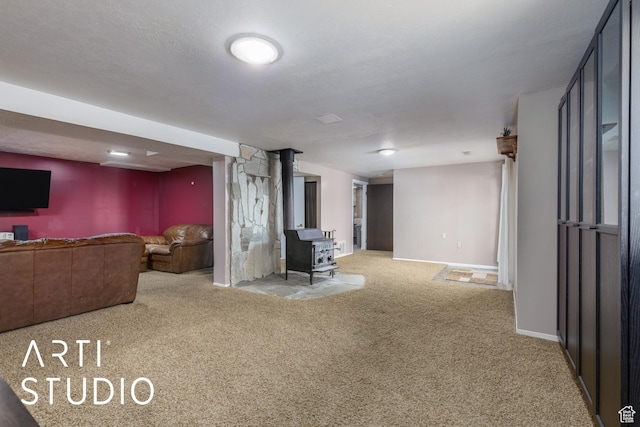 1454 E Harrop St, Ogden, UT 84404 - carpeted living area featuring a wood stove, baseboards, and a textured ceiling