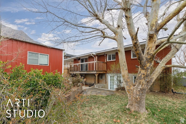 1454 E Harrop St, Ogden, UT 84404 - rear view of property with a wooden deck and brick siding