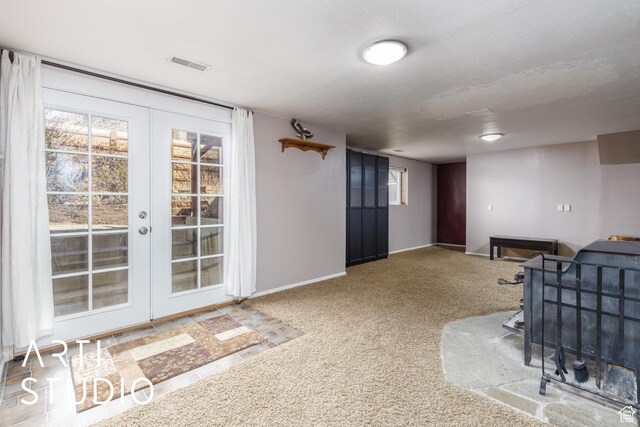 1454 E Harrop St, Ogden, UT 84404 - interior space with french doors, visible vents, baseboards, and carpet