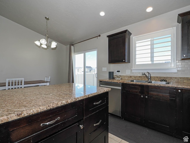 2291 E Ox Yoke Dr N, Eagle Mountain, UT 84005 - kitchen featuring a sink, dishwasher, plenty of natural light, decorative backsplash, and an inviting chandelier