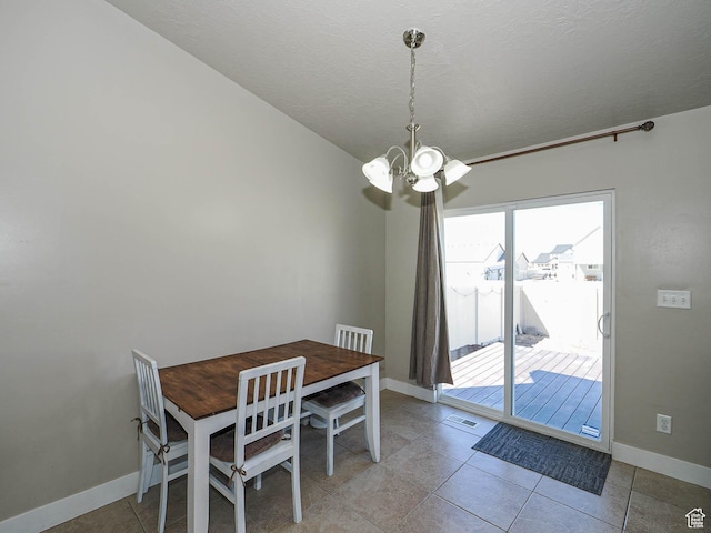 2291 E Ox Yoke Dr N, Eagle Mountain, UT 84005 - tiled dining room with baseboards, visible vents, a textured ceiling, and an inviting chandelier