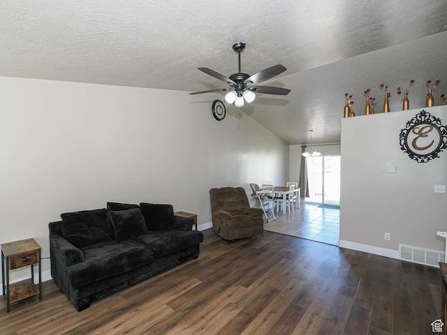 2291 E Ox Yoke Dr N, Eagle Mountain, UT 84005 - living area featuring vaulted ceiling, dark wood finished floors, a textured ceiling, ceiling fan, and visible vents