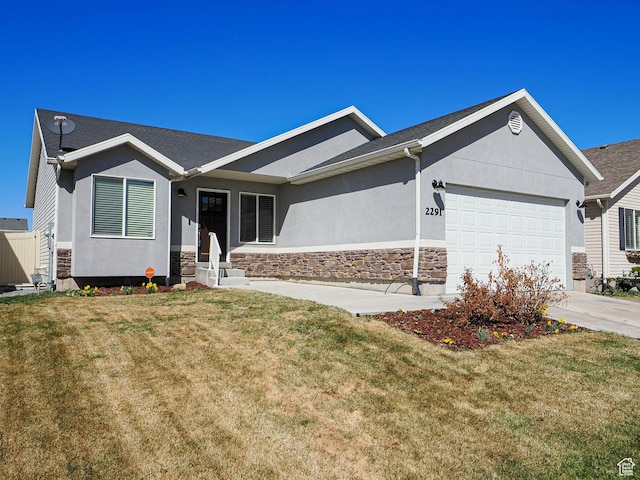 2291 E Ox Yoke Dr N, Eagle Mountain, UT 84005 - ranch-style home with concrete driveway, stucco siding, an attached garage, stone siding, and a front yard