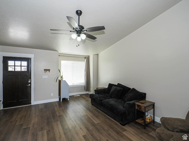2291 E Ox Yoke Dr N, Eagle Mountain, UT 84005 - living room with dark wood-type flooring, a textured ceiling, baseboards, and a ceiling fan