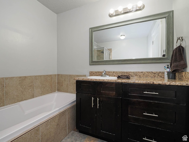 2291 E Ox Yoke Dr N, Eagle Mountain, UT 84005 - bathroom with vanity, a garden tub, and walk in shower