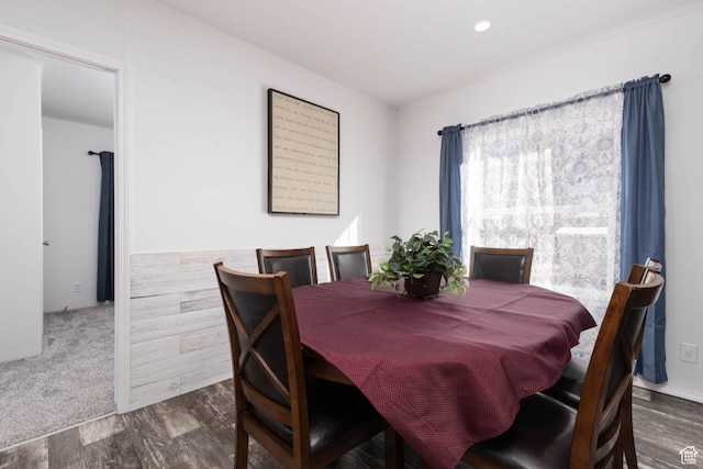 dining area featuring dark wood-type flooring