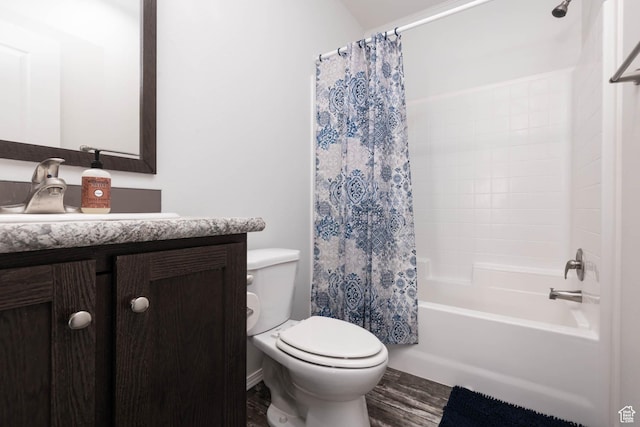 bathroom with wood finished floors, toilet, vanity, and shower / bathtub combination with curtain