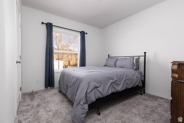 bedroom featuring light carpet