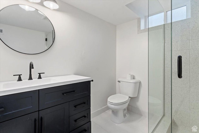 full bath with tile patterned flooring, vanity, toilet, baseboards, and a stall shower