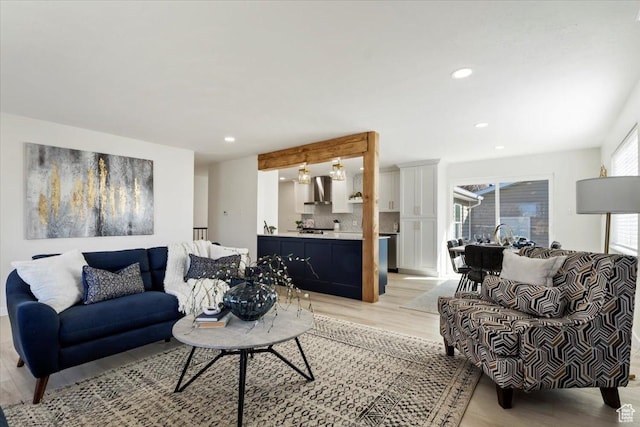 living room with recessed lighting and light wood finished floors