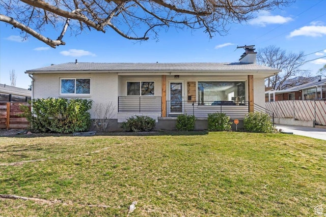 ranch-style house with a front lawn, a chimney, and fence