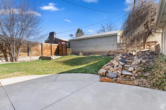 view of yard with fence and a patio