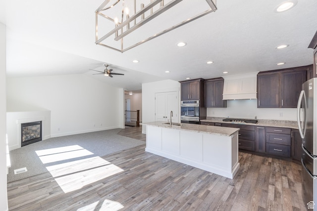 64 N Bywater Way, Brigham City, UT 84302 - kitchen featuring a sink, appliances with stainless steel finishes, recessed lighting, dark brown cabinets, and open floor plan