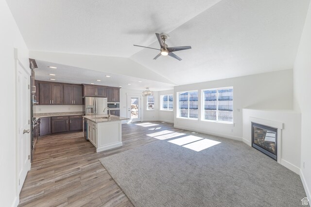 64 N Bywater Way, Brigham City, UT 84302 - kitchen featuring a sink, stainless steel refrigerator with ice dispenser, open floor plan, a ceiling fan, and vaulted ceiling