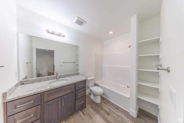 64 N Bywater Way, Brigham City, UT 84302 - full bath with toilet, vanity, wood finished floors, shower / bathtub combination, and recessed lighting