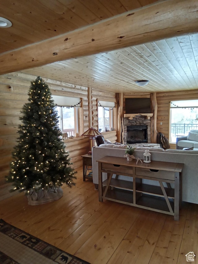 2204 S Timber Lakes Dr S Unit 945, Heber City, UT 84032 - living room with beamed ceiling, log walls, a fireplace, hardwood / wood-style floors, and wood ceiling